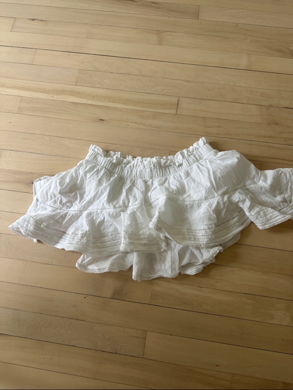 White pull on ruffle skirt